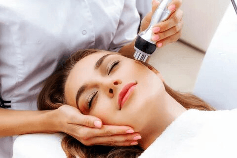 Woman receiving biostimulator facial treatment in Denver to restore natural skin glow and collagen.